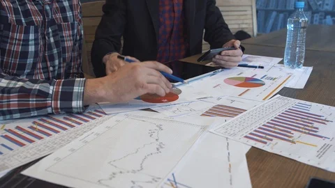 Two businessmen analyze the graphs Stock Footage 86490190