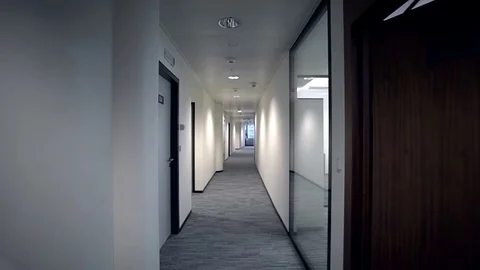 Two businessmen are going through a corridor of the business center. Back view.  Stock Footage 70171350
