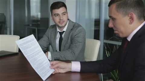 Two businessmen are working with documents in the office of the head. Stock Footage 63574965