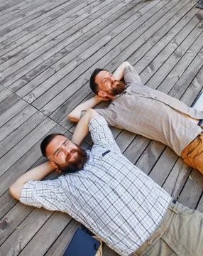 A two businessmen in a break between work. He relaxes looking into the sky Stock Photos