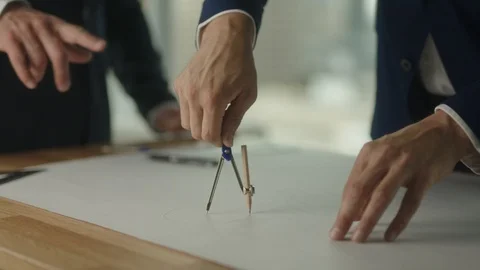 Two businessmen create blueprint in office with view on downtown LA Stock-Footage 127412521