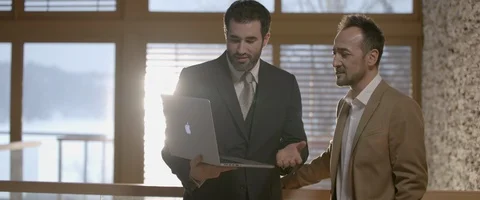 Two businessmen discussing documents Stock Footage 103096923