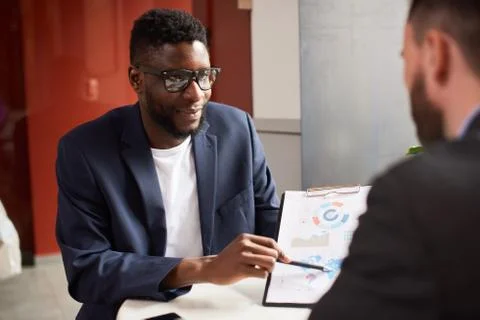Two businessmen discussing needed changes in the project. Stock Photos