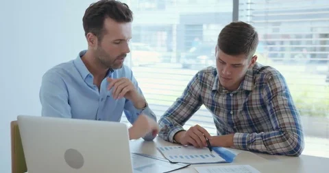 Two businessmen doing financial analysis Video stock 69170857