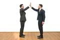 The two businessmen greeting on the white wall background Photo
