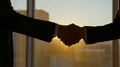 The two businessmen handshake on the sunrise background. slow motion 4k or 4k+ Resolution
