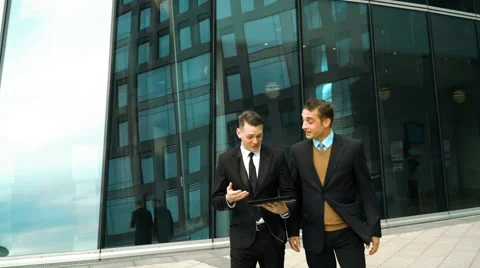 Two businessmen have a break Stock Footage 64456486