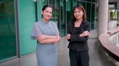 The two businessmen looked into the camera smiling to celebrate their success. Stock Footage 265229233