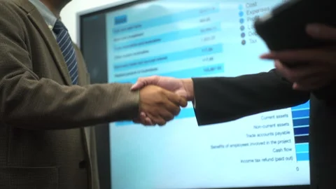 Two businessmen making handshake with partner and greeting personal achievement. Stock Footage 278214701
