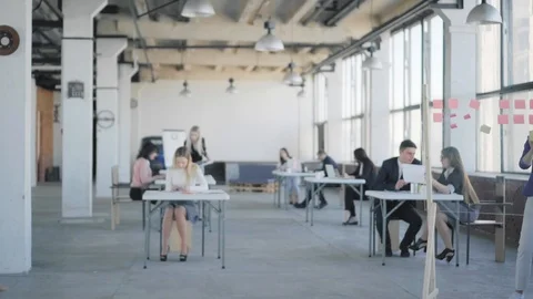 Two businessmen meet, shake hands and walk around the office. Coworking. Office Stock Footage 108939292