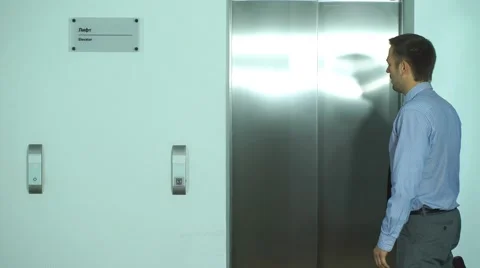 Two businessmen met at the Elevator and talking to Stock Footage 67495193