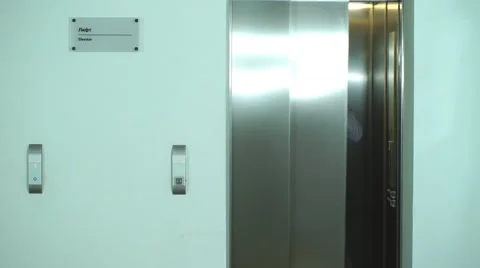Two businessmen out of the Elevator and talking on the phone Stock Footage 67495250