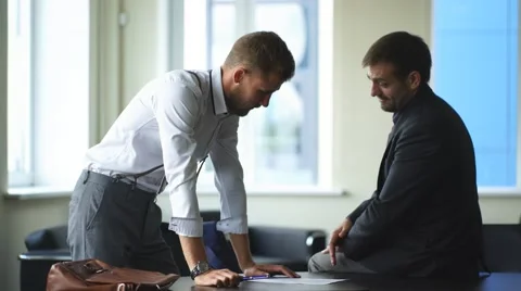 Two businessmen signed an important contract at the office Stock Footage 67884056