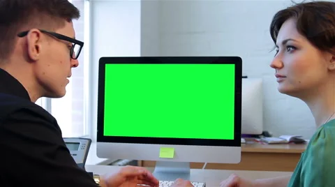 Two businessmen talking and looking at the computer display Stock Footage 51169065