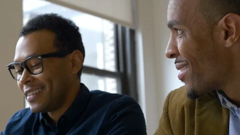 Two businessmen talking in the office Stock Footage 93534427