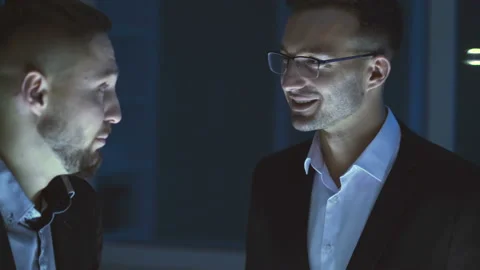 The two businessmen talking on the office Stock Footage 100560380