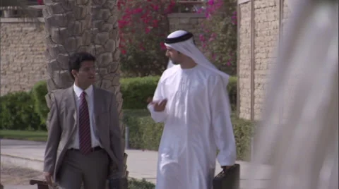 Two businessmen walk while have a conversation. Stock Footage 46867870