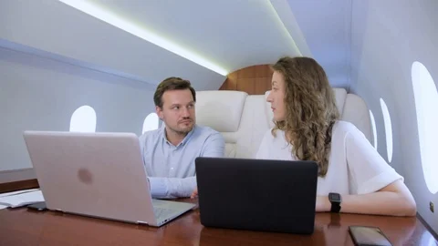Two businessmen work on private plane 스톡 동영상 113144283