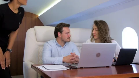 Two businessmen work on private plane 스톡 동영상 113497512