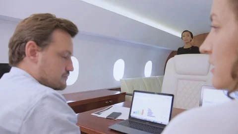 Two businessmen work on private plane 스톡 동영상 113999079