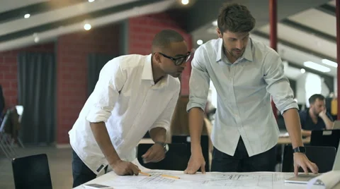Two businessmen working with documents Stock Footage 64525198