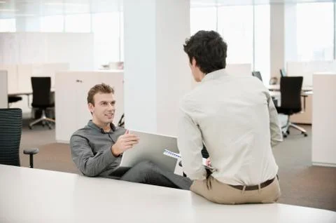 Two businessmen working in an office Stock Photos