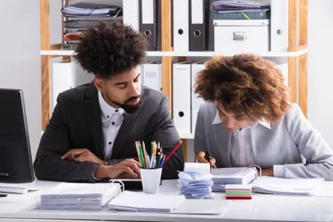 Two Businesspeople Checking Invoice Foto stock