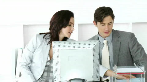 Two businesspeople working at a computer Stock Footage 631992