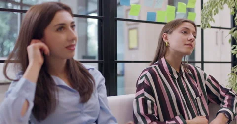 Two Businesswomen Collaborating on a Project, Talking and Sharing Ideas in a Stock Footage 319038232
