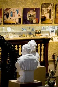 Two bust images with various objects in the background; Exhibition Held in... Stock Photos
