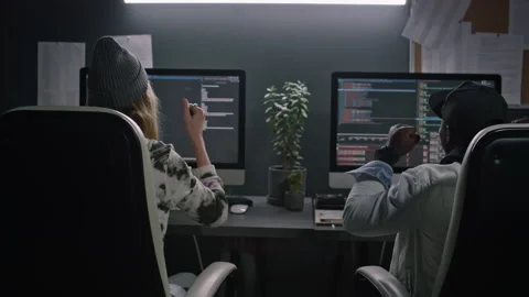 Two Busy Diverse Software Developers Working on Computer Code at Night Stock Footage 273832834