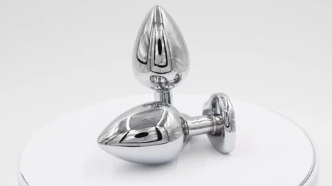 Two butt plugs on white background Stock Footage 275279395