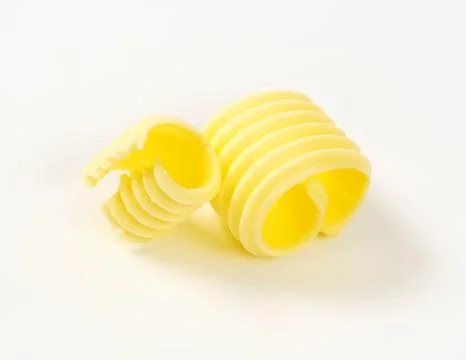 Two butter curls Stock Photos