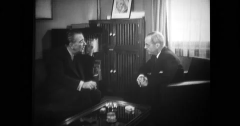 Two cabinet officers sitting inside government building at a discussion Stock Footage 43502460