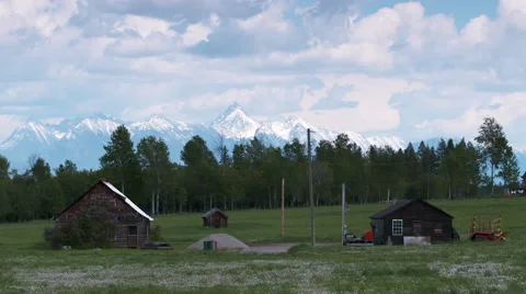 Two cabins with mountain backdrop Stock Footage 67610331