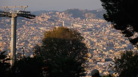 Two cable cars are moving simultaneously against the backdrop of the old city Stock Footage 101200268