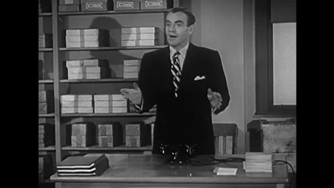 Two cackling friends demonstrate the wrong way to answer a business call in Stock Footage 143838755