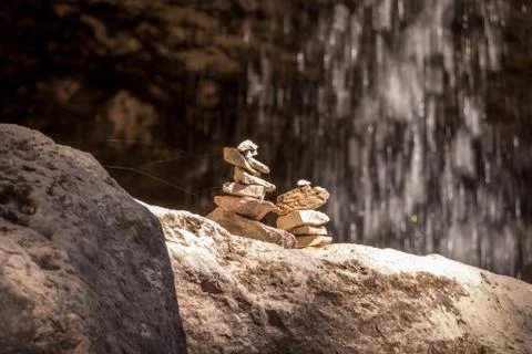 Two Cairns by a Water Fall Foto stock