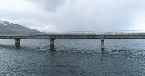 Two campervan crossing the bridge over the sea Stock Footage 86177933