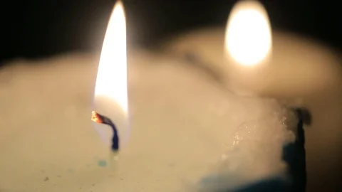 Two candles are lit in the dark room Stock Footage 81592879