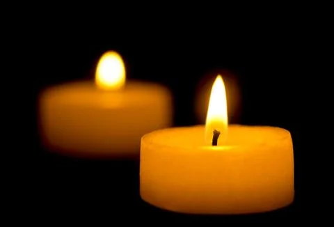 Two candles in the dark Stock Photos