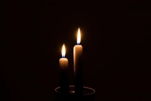 Two candles in the dark Photos