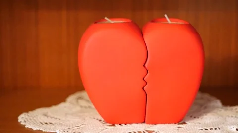 Two candles joined together making shape of heart Stock Footage 88411905