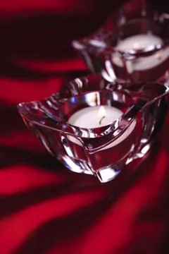 Two candles on red Stock Photos