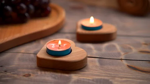 Two Candles on Wooden Table Stock Footage 273710626