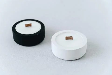 Two Candlesticks Made of Gypsum with Soy Wax on White and Black Background Di Stock Photos