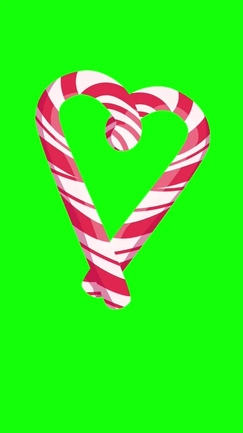 Two candy canes form a wiggling heart on a green screen. Stock Footage 320954599