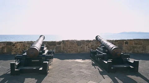 Two cannons of the seventeenth century pointed towards the sea Stock Footage 106636677