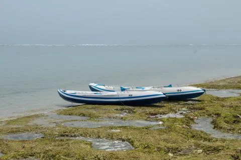 Two canoe on the ocean beach Stock Photos