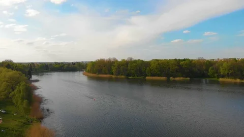 Two canoes float along the lake. floating aerial video drone Stock Footage 107942783